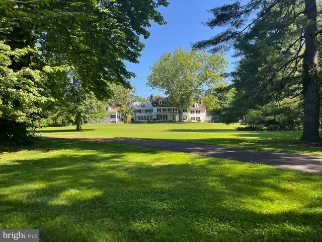 an aerial view of a house with yard