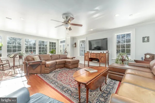 a bathroom with a granite countertop toilet a sink and bathtub