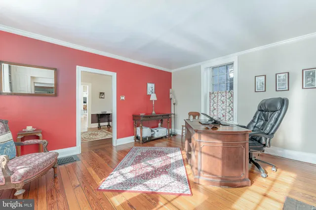 a bedroom with a bed and a table with chair