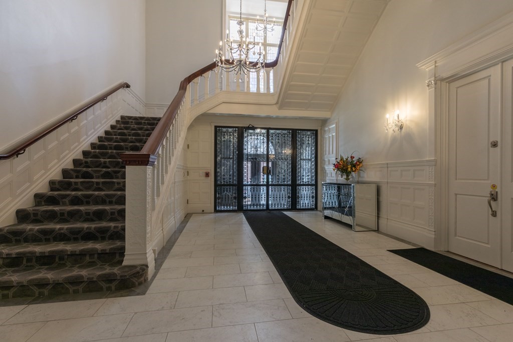 a view of entryway and hall with a front door
