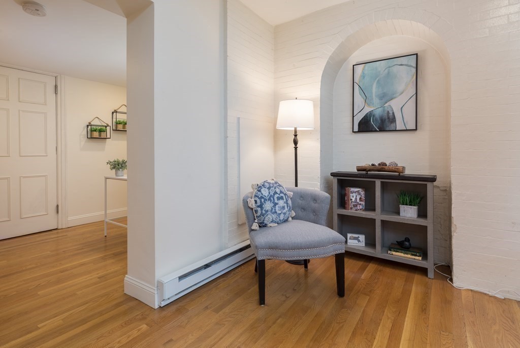 17 Gloucester Street, Unit A Boston, MA 02116 - Photo 14 of 20 a view of a livingroom with furniture and wooden floor