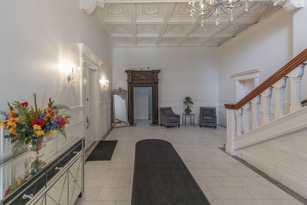 17 Gloucester Street, Unit A Boston, MA 02116 - Photo 17 of 20 a lobby with furniture and flowers