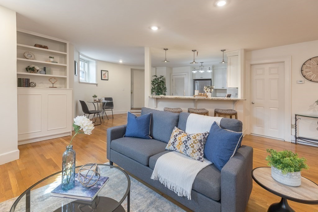 17 Gloucester Street, Unit A Boston, MA 02116 - Photo 4 of 20 a living room with furniture and a dining table