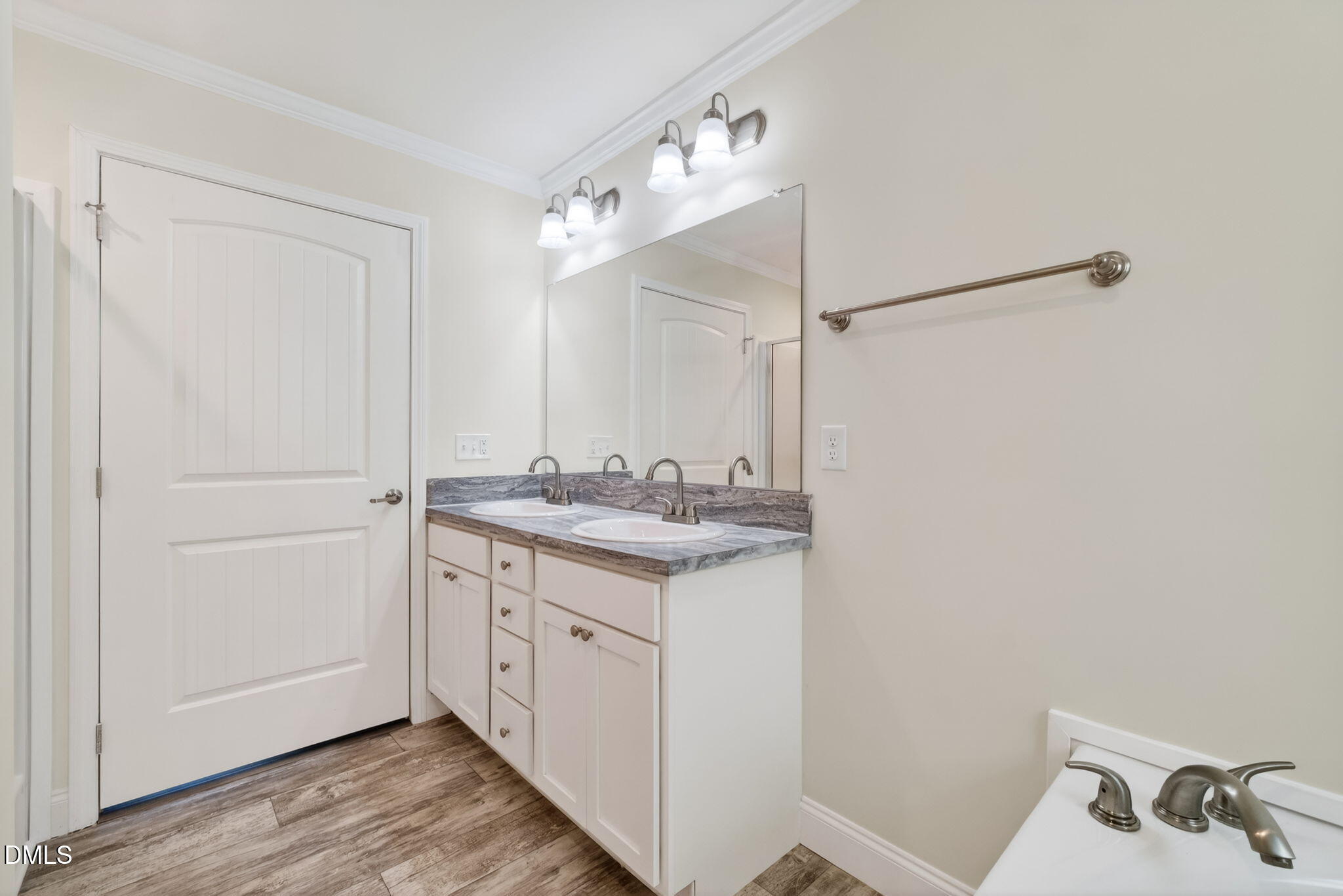 7122 Guess Road Hillsborough, NC 27278 - Photo 30 of 48 a bathroom with a sink vanity and a mirror