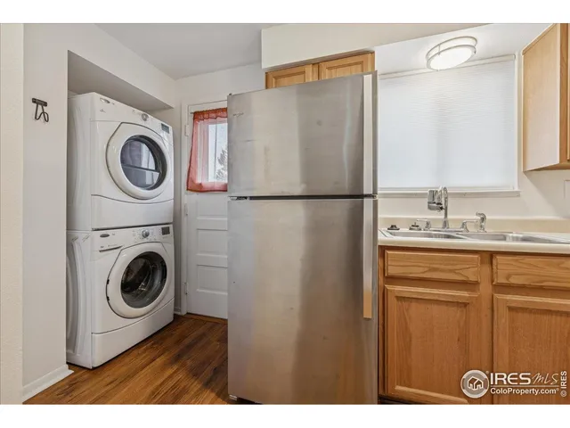 a utility room with sink dryer and washer