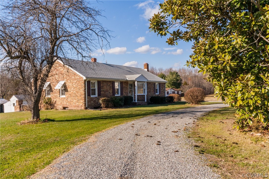 4761 Three Chopt Road Louisa, VA 23093 - Photo 2 of 32 a front view of a house with a yard