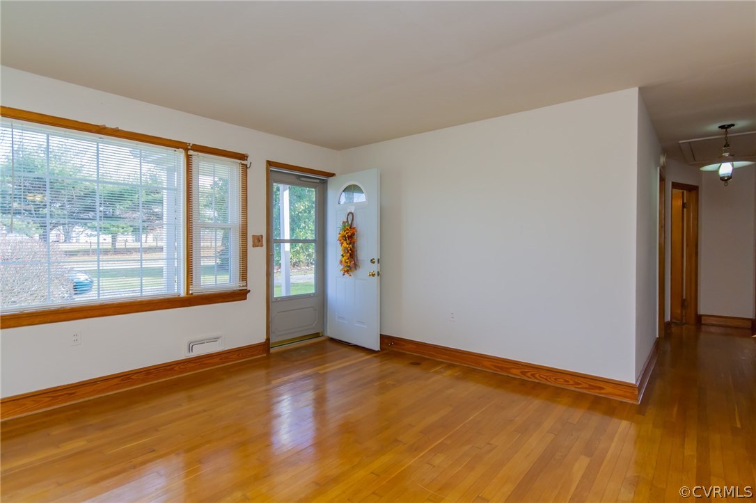 4761 Three Chopt Road Louisa, VA 23093 - Photo 3 of 32 wooden floor in an empty room with a window