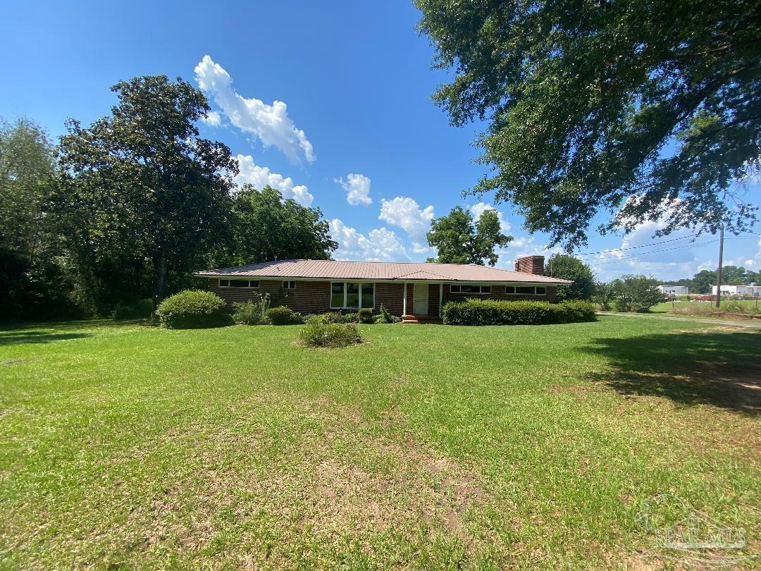 3224 Highway 4 Jay, FL 32565 - Photo 1 of 38 a view of an house with backyard space and garden