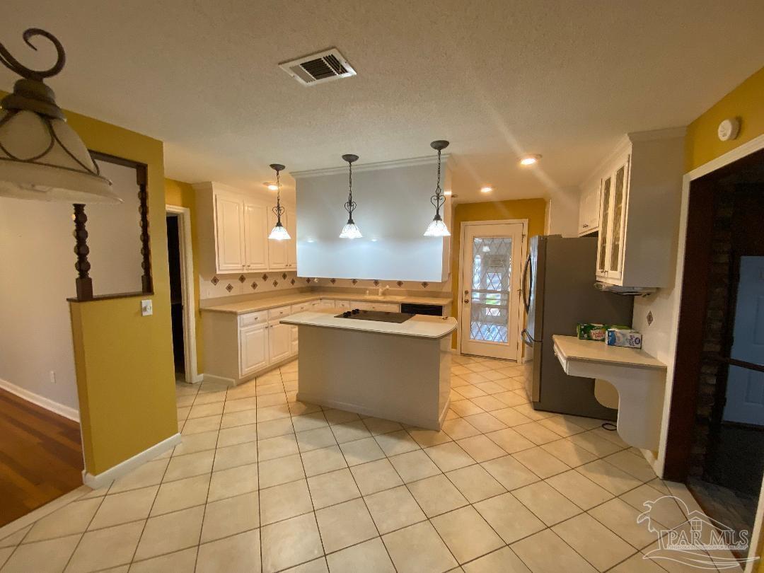 3224 Highway 4 Jay, FL 32565 - Photo 12 of 38 a large kitchen with a large counter top space a sink a refrigerator and a stove