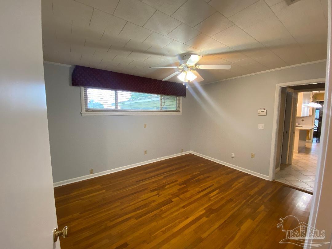 3224 Highway 4 Jay, FL 32565 - Photo 18 of 38 en empty room with window and wooden floor