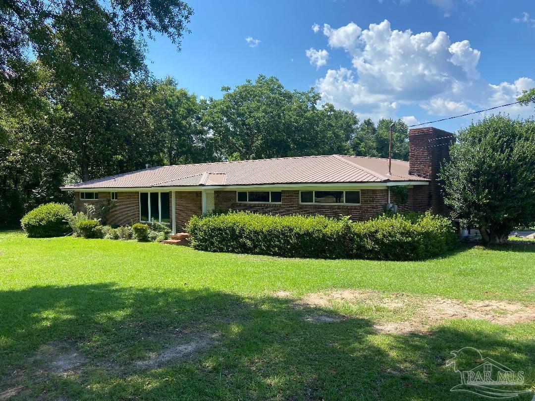 3224 Highway 4 Jay, FL 32565 - Photo 3 of 38 a front view of a house with a yard