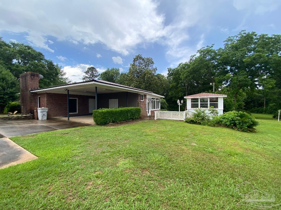 3224 Highway 4 Jay, FL 32565 - Photo 26 of 38 a front view of house with yard and green space