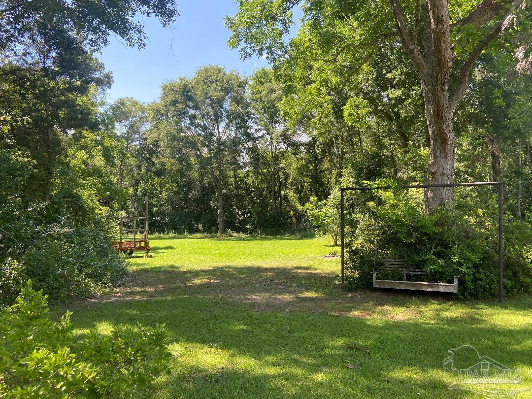 3224 Highway 4 Jay, FL 32565 - Photo 29 of 38 a view of a golf course with a lake