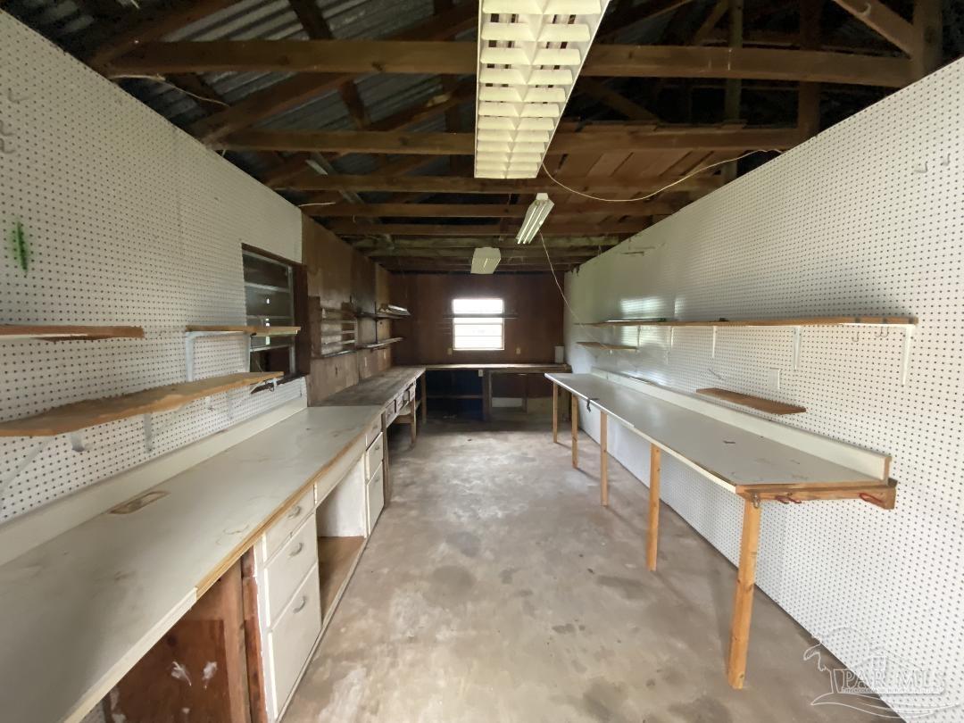 3224 Highway 4 Jay, FL 32565 - Photo 33 of 38 a kitchen with stainless steel appliances granite countertop a sink a stove and a refrigerator