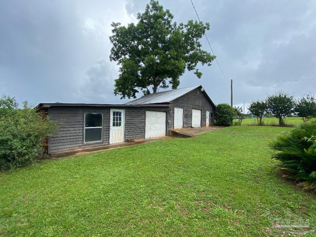 3224 Highway 4 Jay, FL 32565 - Photo 7 of 38 a front view of house with yard and green space