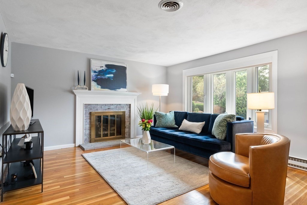 4 Rayner Circle Stoneham, MA 02180 - Photo 1 of 27 a living room with furniture and a fireplace
