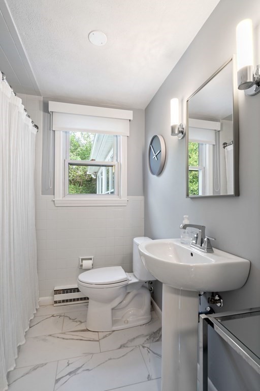 4 Rayner Circle Stoneham, MA 02180 - Photo 14 of 27 a bathroom with a sink toilet and a mirror