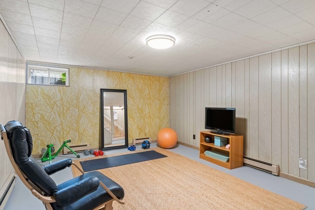 4 Rayner Circle Stoneham, MA 02180 - Photo 15 of 27 a bedroom with furniture and a flat screen tv