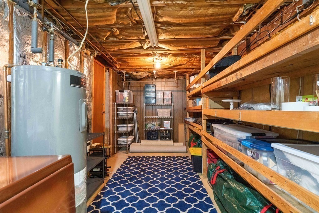 4 Rayner Circle Stoneham, MA 02180 - Photo 16 of 27 a room with stainless steel appliances kitchen island granite countertop furniture and a shower
