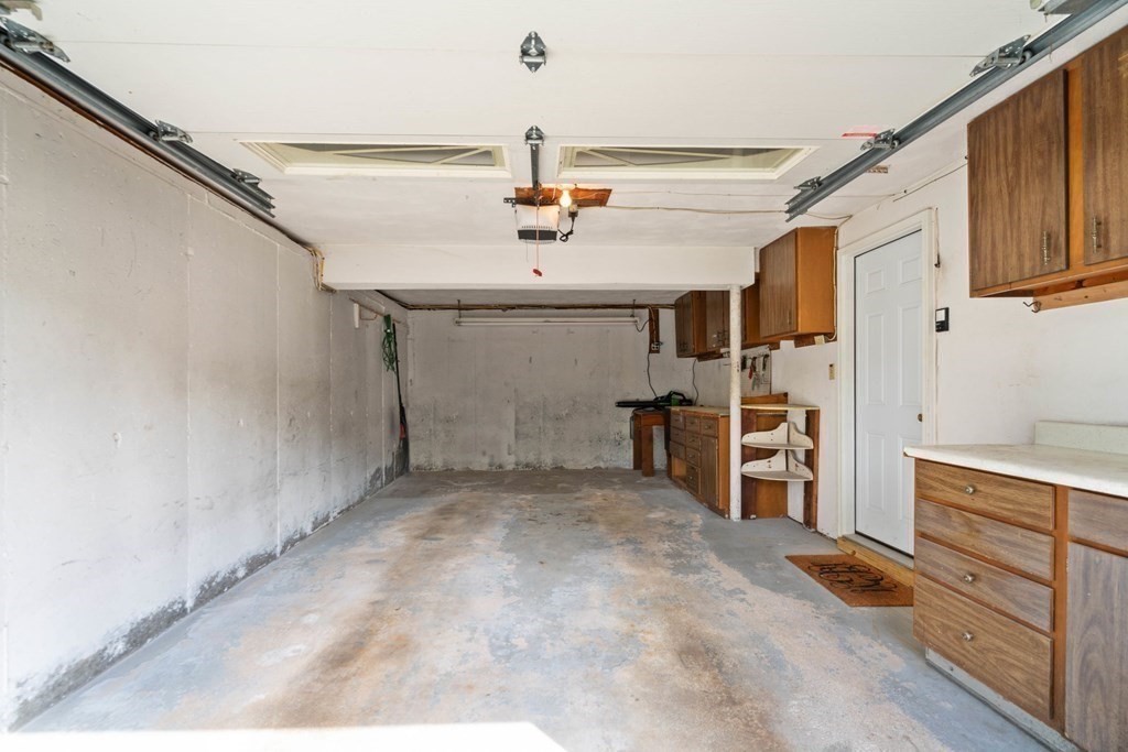 4 Rayner Circle Stoneham, MA 02180 - Photo 22 of 27 a view of a kitchen with refrigerator and cabinets