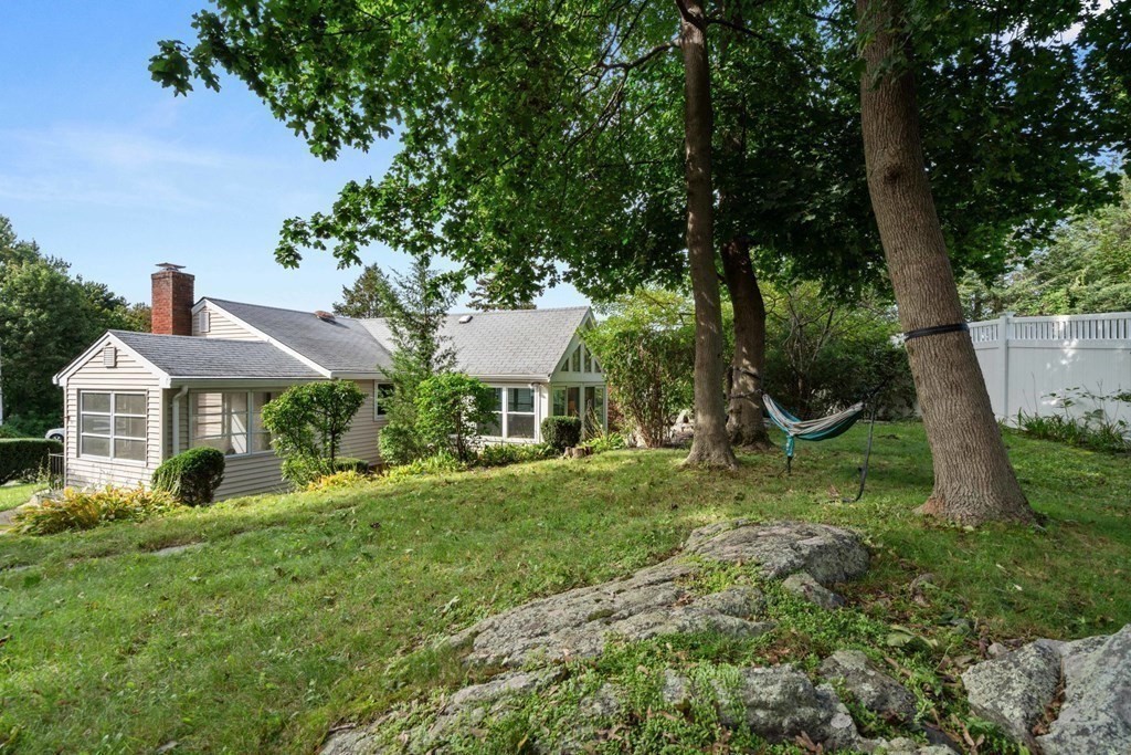 4 Rayner Circle Stoneham, MA 02180 - Photo 25 of 27 a view of a house with a backyard