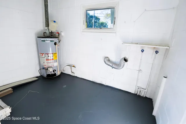 a view of an empty room with windows