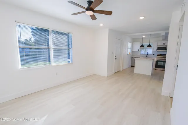 a view of an empty room with a window