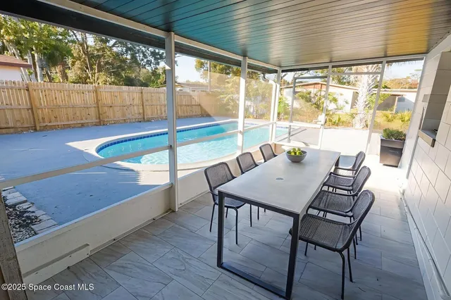 a view of a swimming pool with a porch