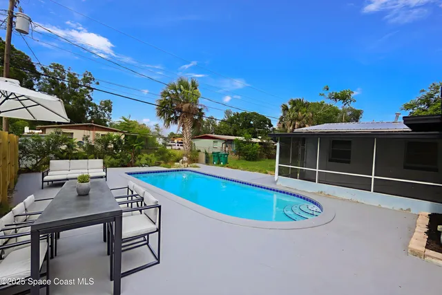 a kitchen with sink a microwave and cabinets