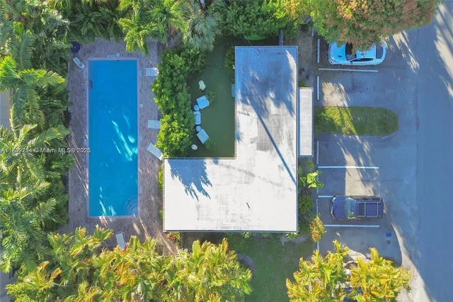 a view of a front of a house with a fountain
