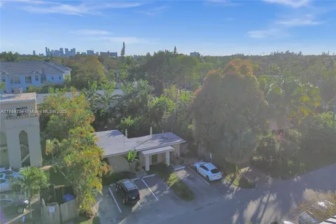 an aerial view of a house with a garden