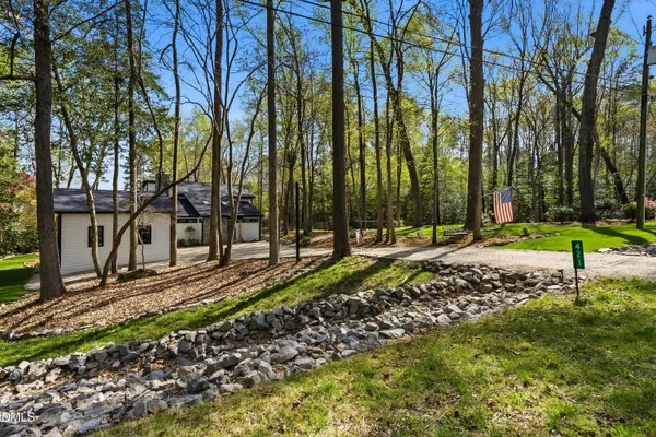 a view of a house with backyard porch and sitting area