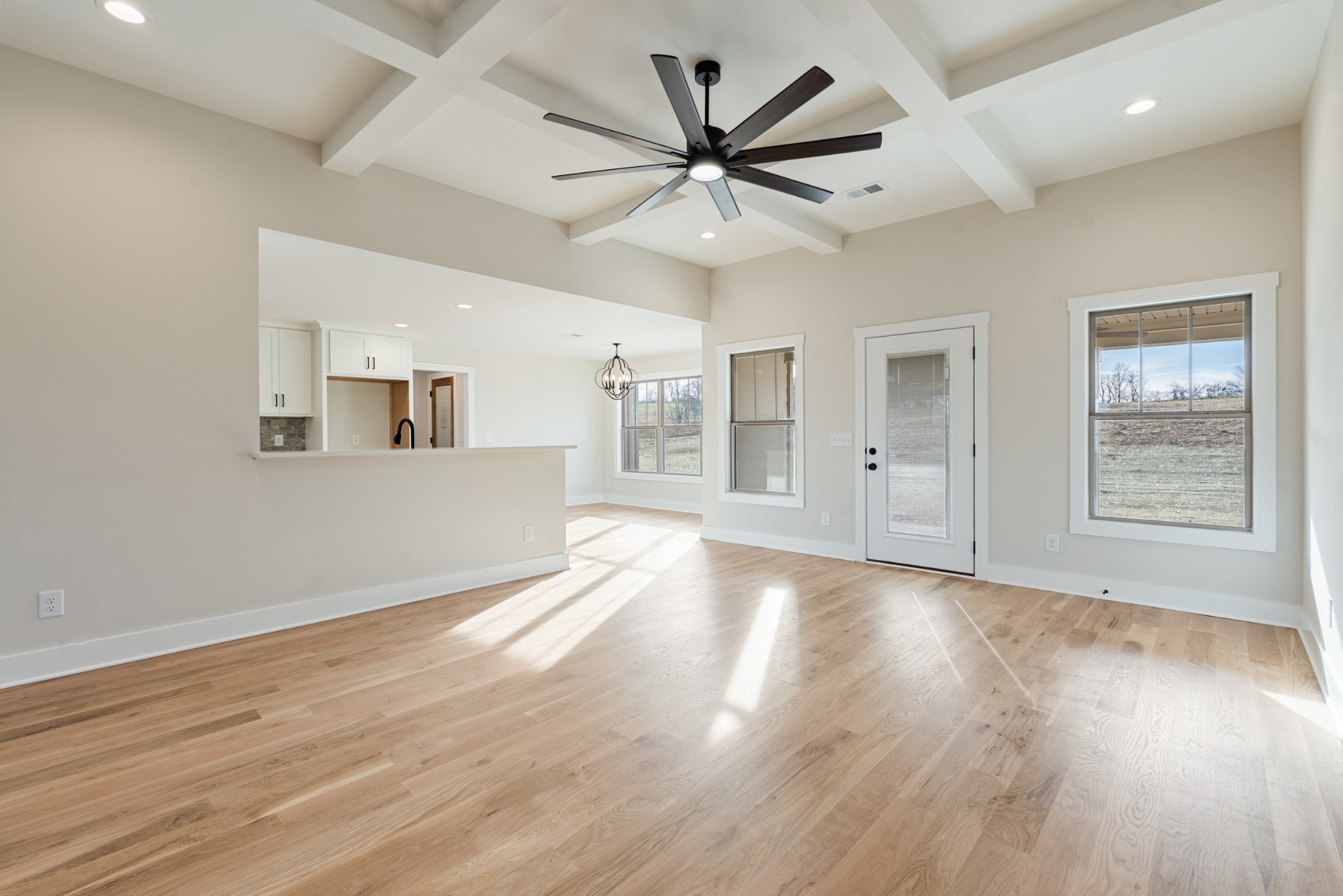 8078 Gideon Road Greenbrier, TN 37073 - Photo 8 of 26 a view of an empty room with wooden floor and a window