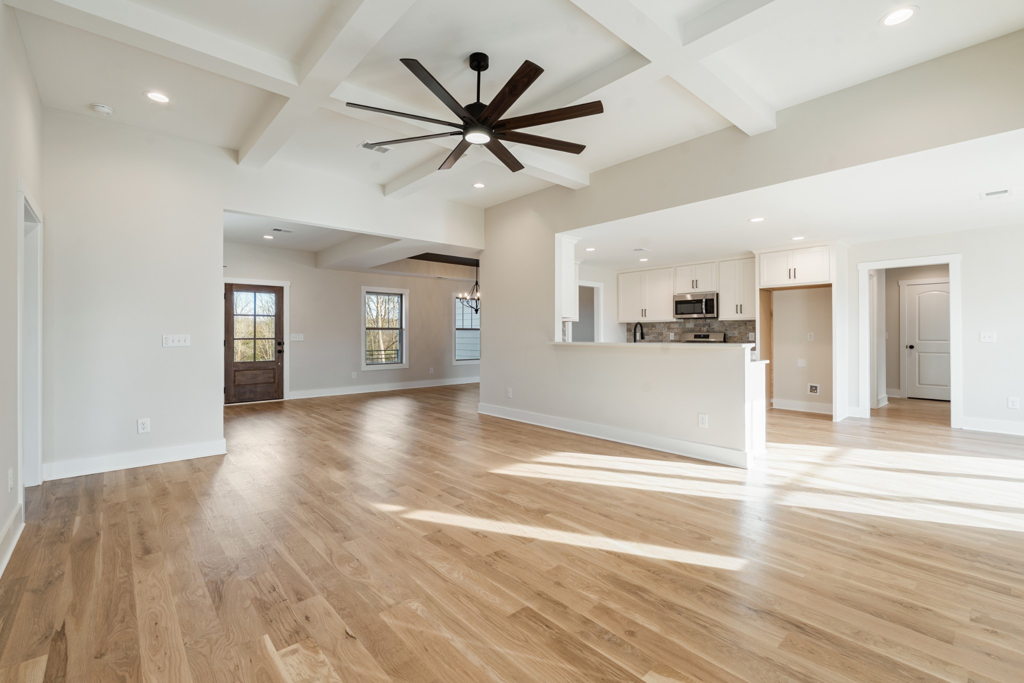 8078 Gideon Road Greenbrier, TN 37073 - Photo 9 of 26 a view of a livingroom with a ceiling fan wooden floor and window