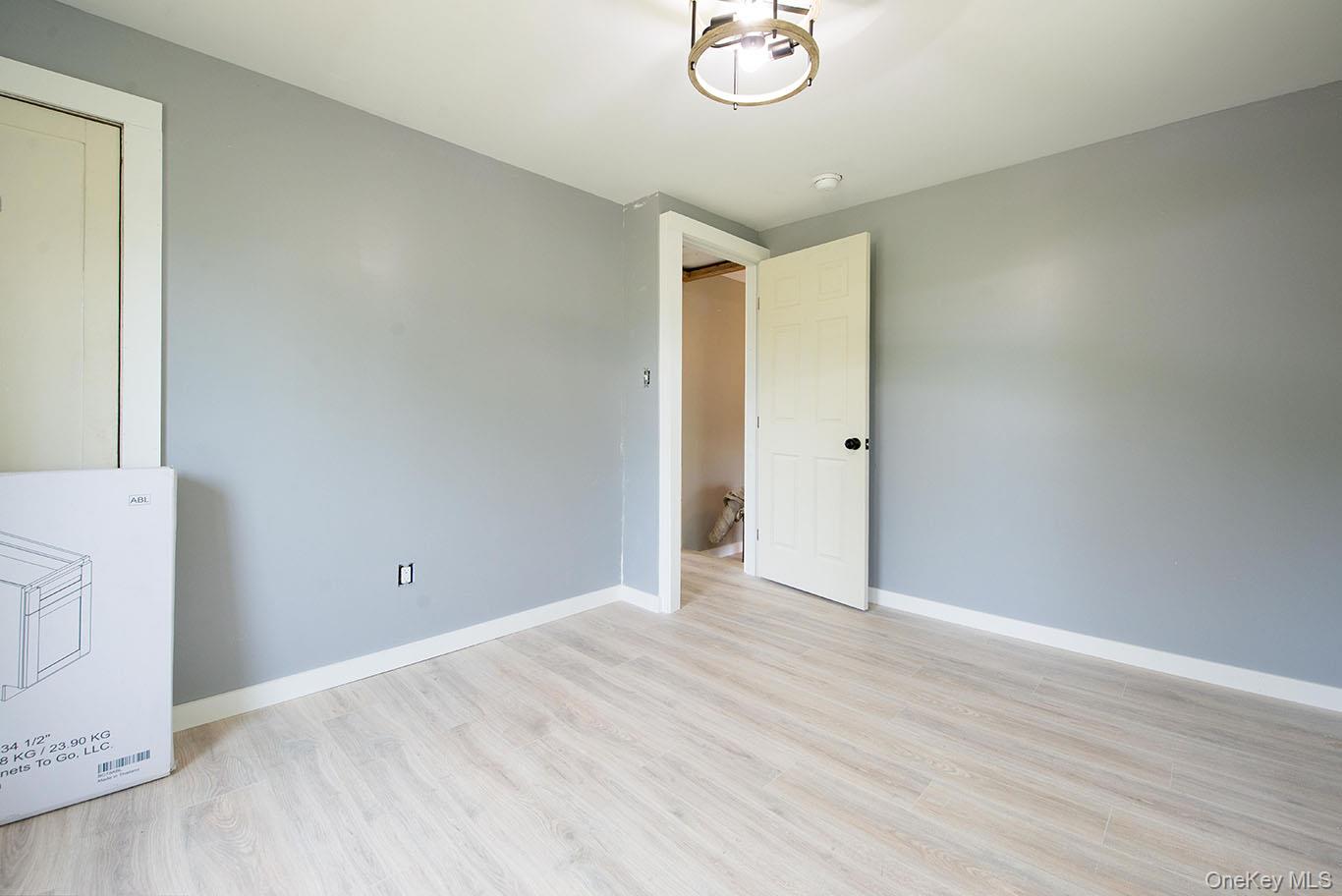 1132 Old Rte 17 Harris, NY 12742 - Photo 9 of 26 Empty room with light wood-style flooring and baseboards