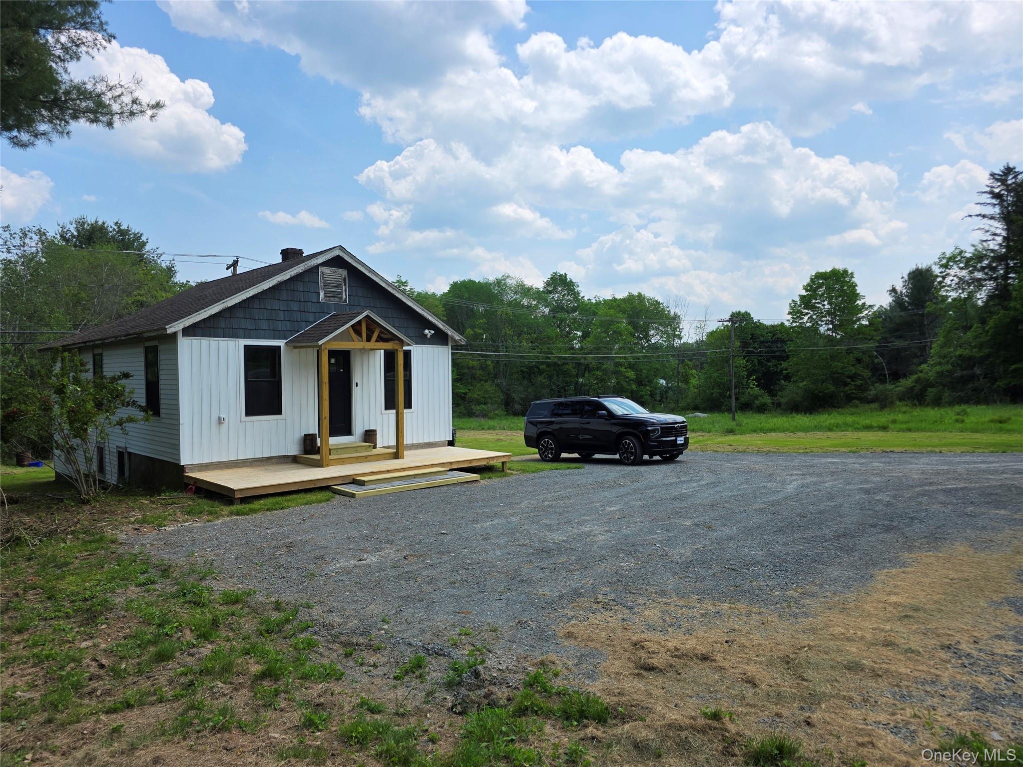 1132 Old Rte 17 Harris, NY 12742 - Photo 10 of 26 View of front of home featuring board and batten siding and a chimney