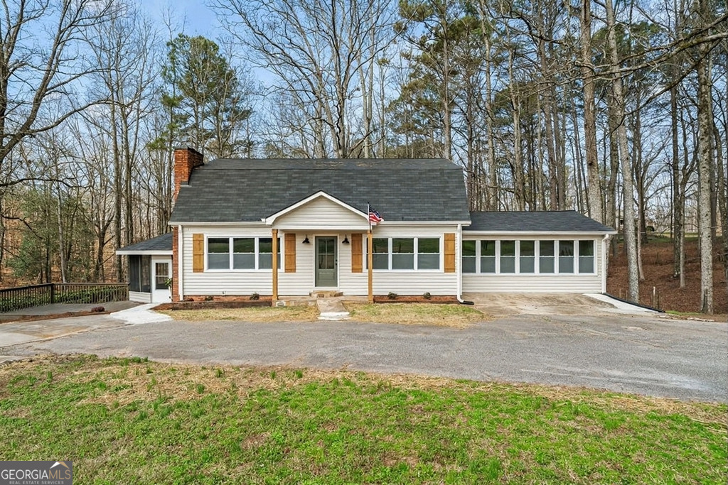 18 Holder Road Temple, GA 30179 - Photo 1 of 44 a front view of a house with a garden
