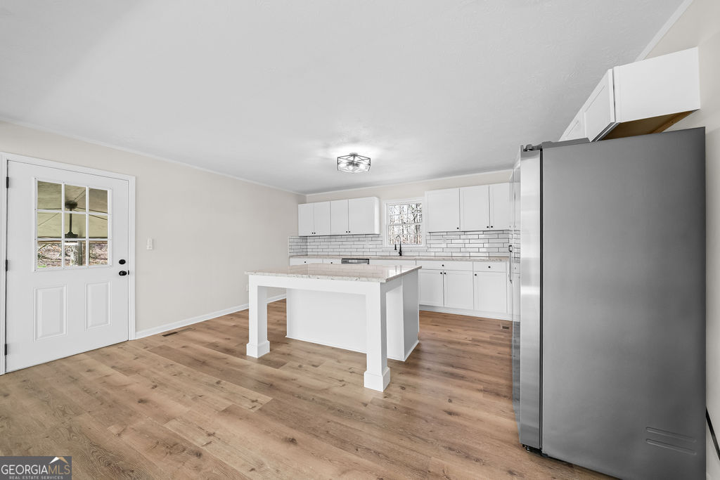 18 Holder Road Temple, GA 30179 - Photo 12 of 44 a kitchen with a refrigerator and a sink