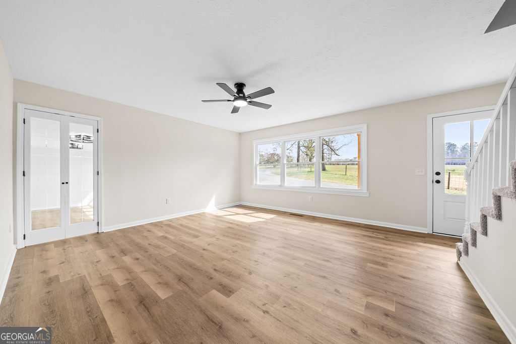 18 Holder Road Temple, GA 30179 - Photo 15 of 44 a view of an empty room with a window and wooden floor
