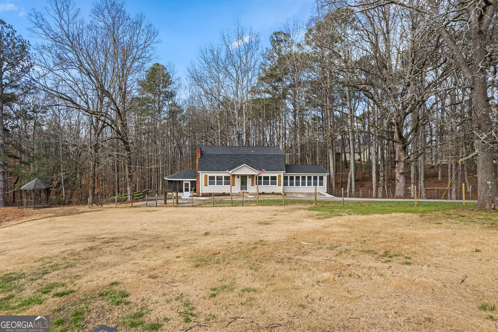 18 Holder Road Temple, GA 30179 - Photo 2 of 44 a front view of a house with a yard and trees