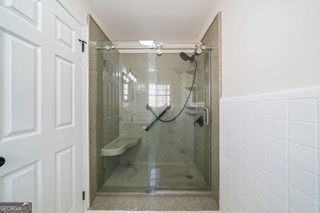 18 Holder Road Temple, GA 30179 - Photo 21 of 44 a bathroom with a glass shower door