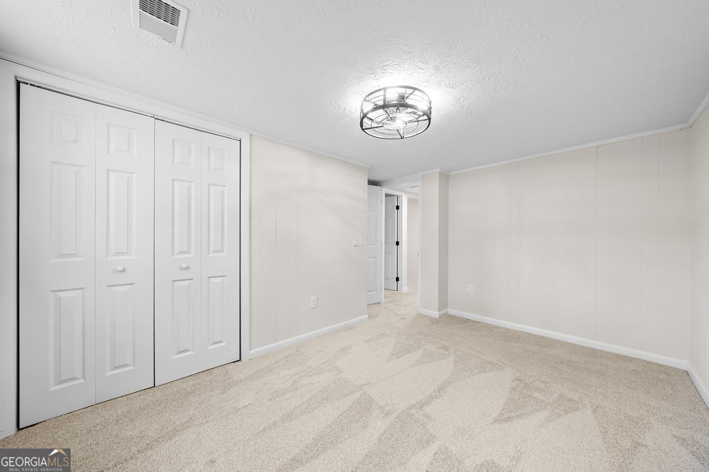 18 Holder Road Temple, GA 30179 - Photo 28 of 44 an empty room with a empty space and a ceiling fan