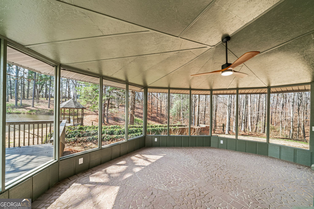 18 Holder Road Temple, GA 30179 - Photo 32 of 44 a view of a room with wooden floor and iron stairs