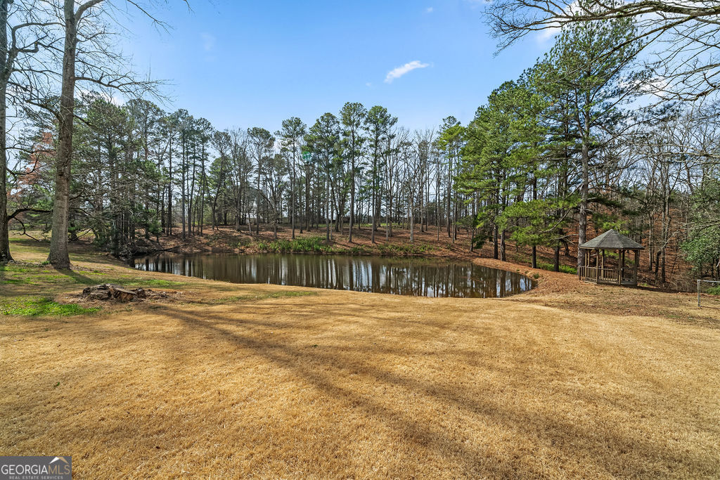 18 Holder Road Temple, GA 30179 - Photo 39 of 44 a view of a yard with trees in the background