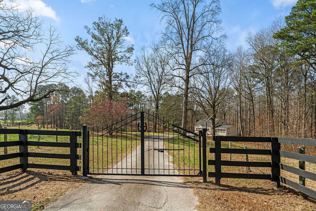18 Holder Road Temple, GA 30179 - Photo 43 of 44 a view of a street with a bench next to a yard