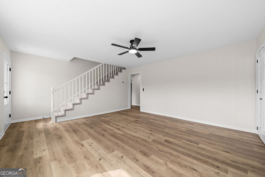 18 Holder Road Temple, GA 30179 - Photo 8 of 44 a view of empty room with wooden floor and fan