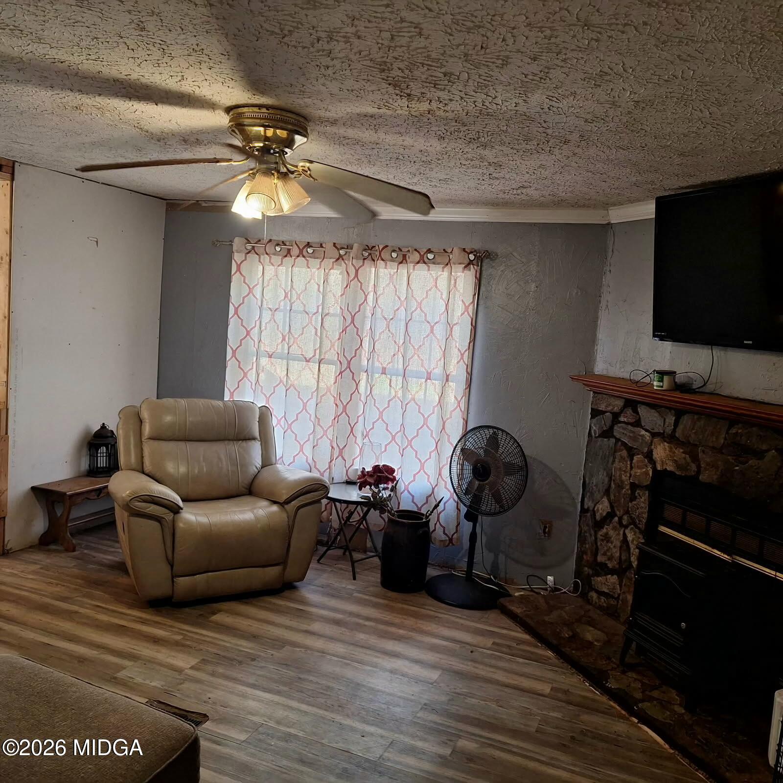 680 Natures Trail Forsyth, GA 31029 - Photo 11 of 14 a living room with furniture and a flat screen tv