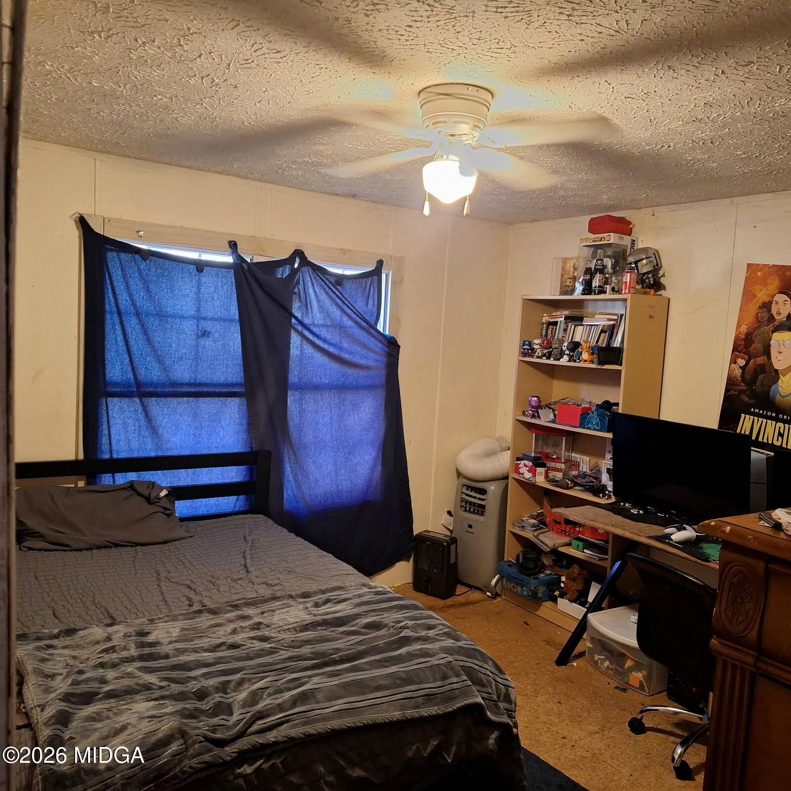 680 Natures Trail Forsyth, GA 31029 - Photo 12 of 14 a bedroom with a bed and a desk