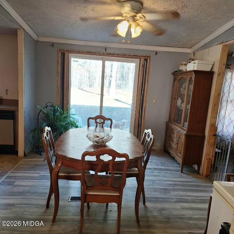 680 Natures Trail Forsyth, GA 31029 - Photo 6 of 14 a view of a dining room with furniture window and wooden floor