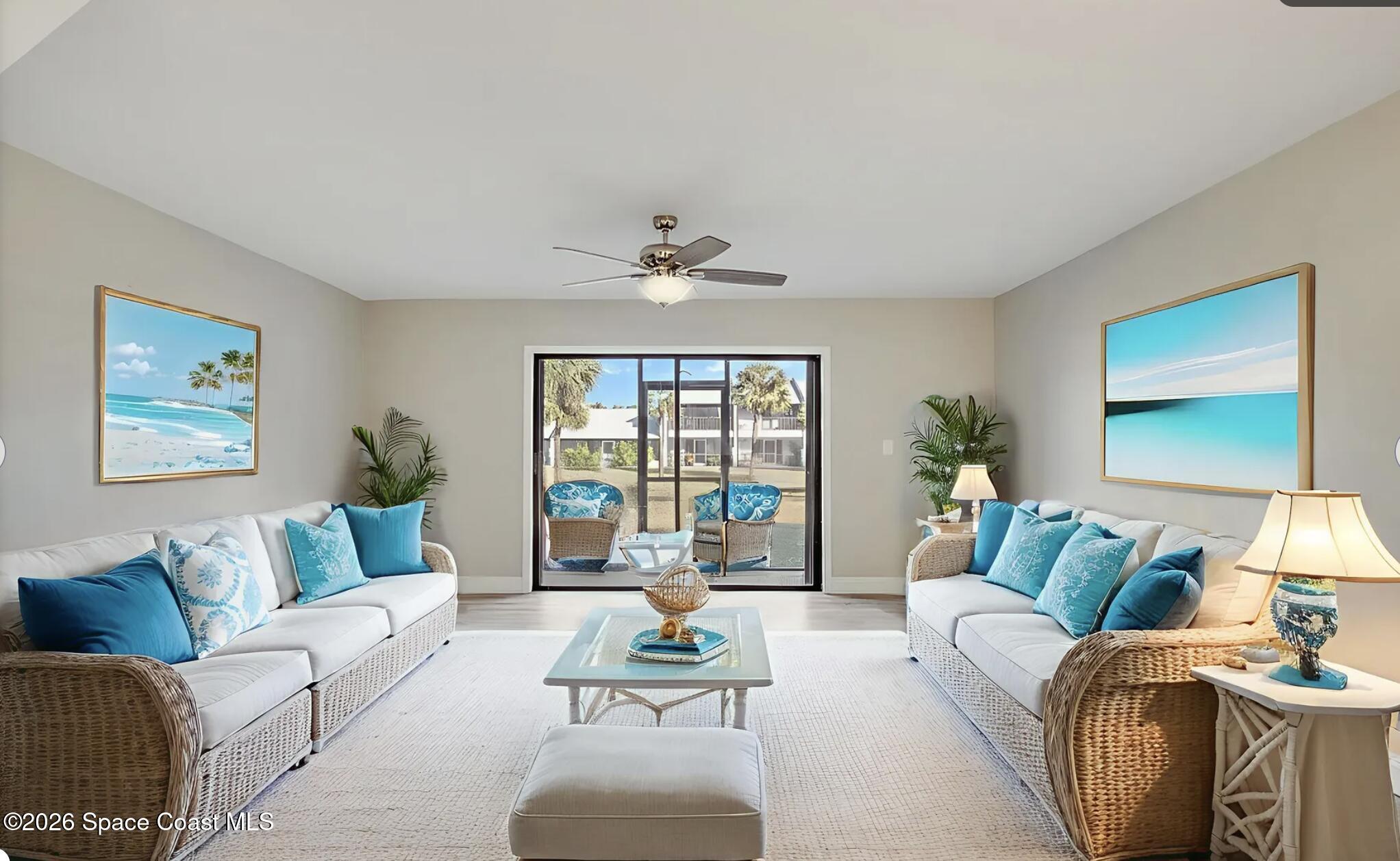 720 Palm Springs Circle Indian Harbour Beach, FL 32937 - Photo 14 of 57 a living room with furniture and a large window